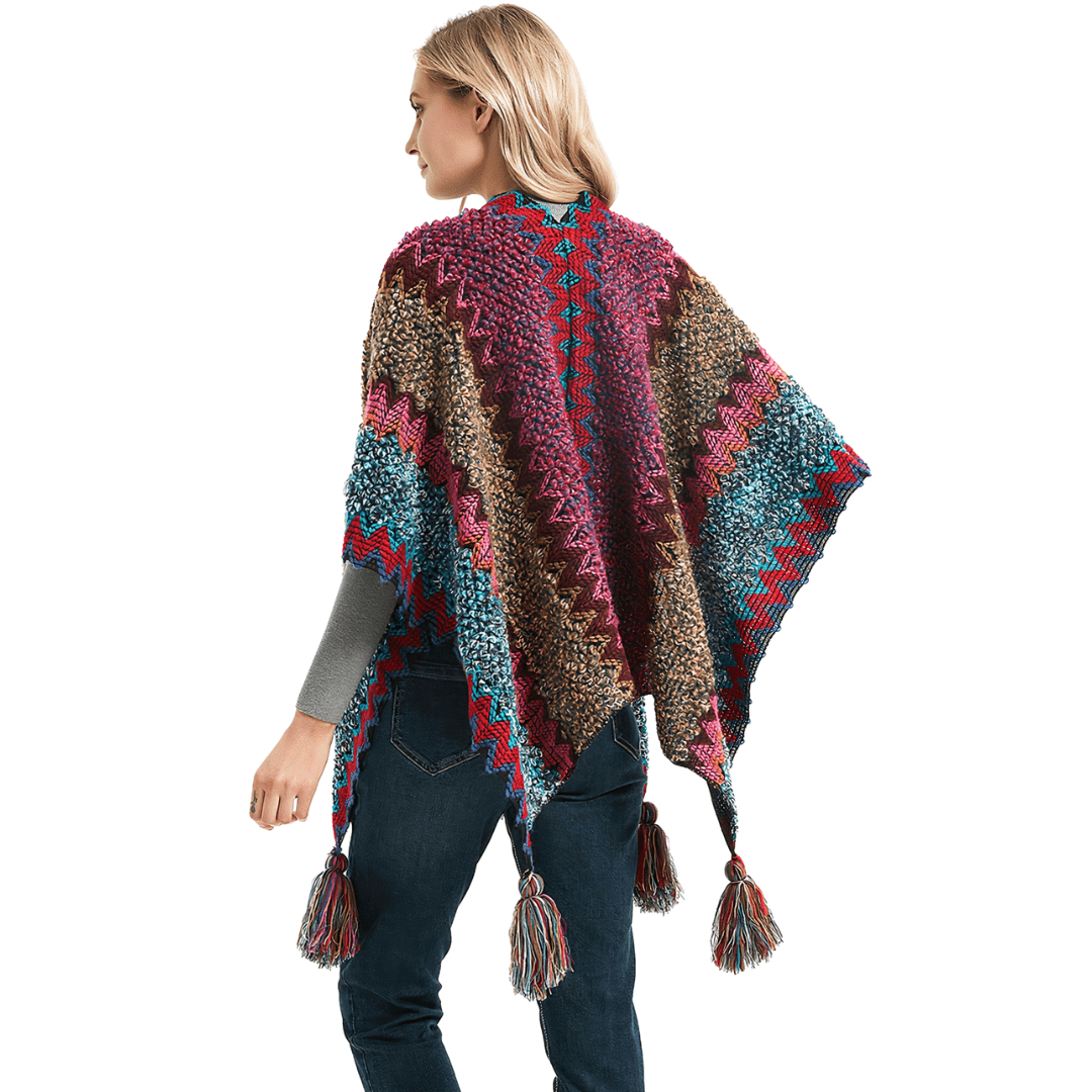 poncho avec pompons